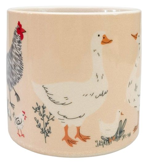 Chicken and Friends ceramic planter pot displaying herbs in a farmhouse kitchen setting.