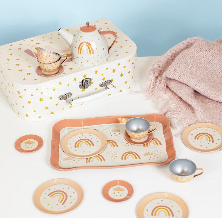 Children's tea set with rainbow design on a light blue background