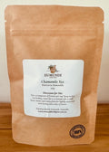 Eumundi herb Farm Chamomile Tea package on a wooden surface with a plain background