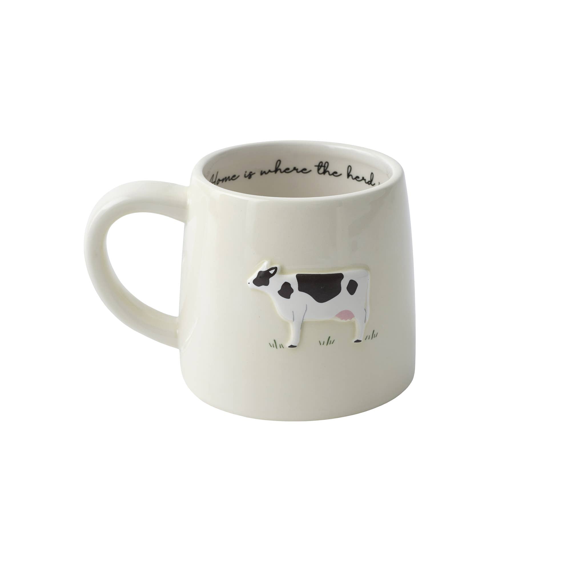 White stoneware mug with a cow illustration and text on a white background