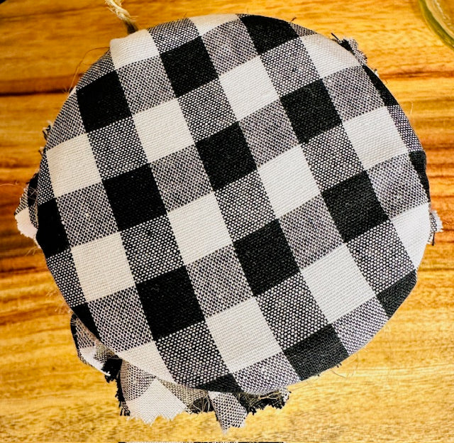 Black and white checkered fabric on a wooden surface