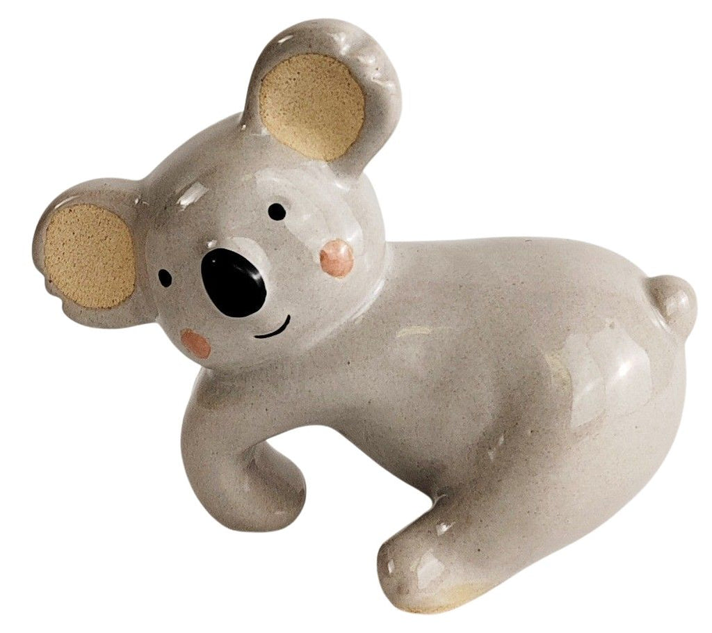 Ceramic mouse figurine on a white background