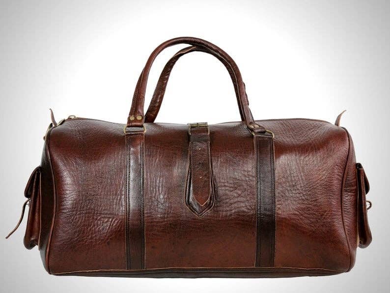 Brown leather duffel bag on a white background