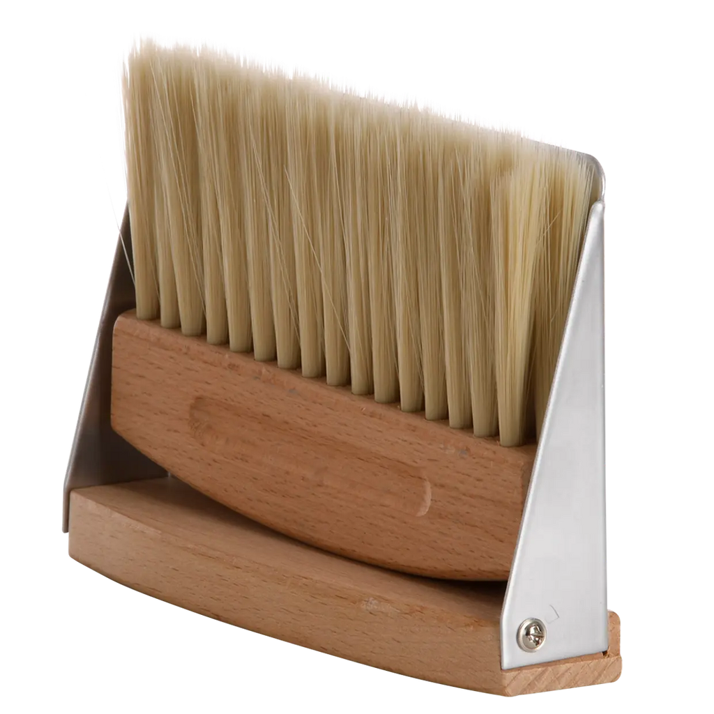 Table dustpan and broom set with packaging on a white background