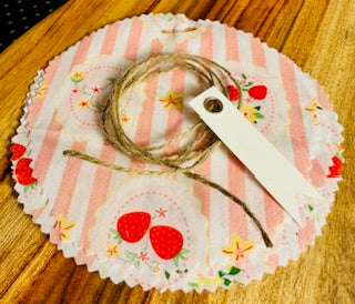 Decorative paper with strawberry pattern on a wooden surface