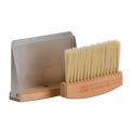 Wooden brush with metal handle on a white background