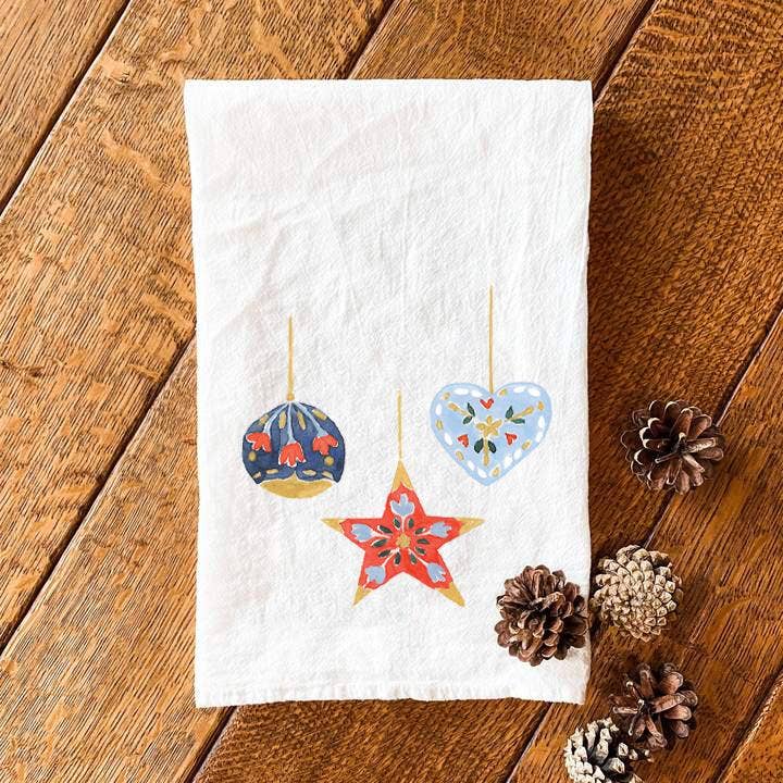 cotton tea towel flour sack style printed with christmas ornaments. the eumundi trading co