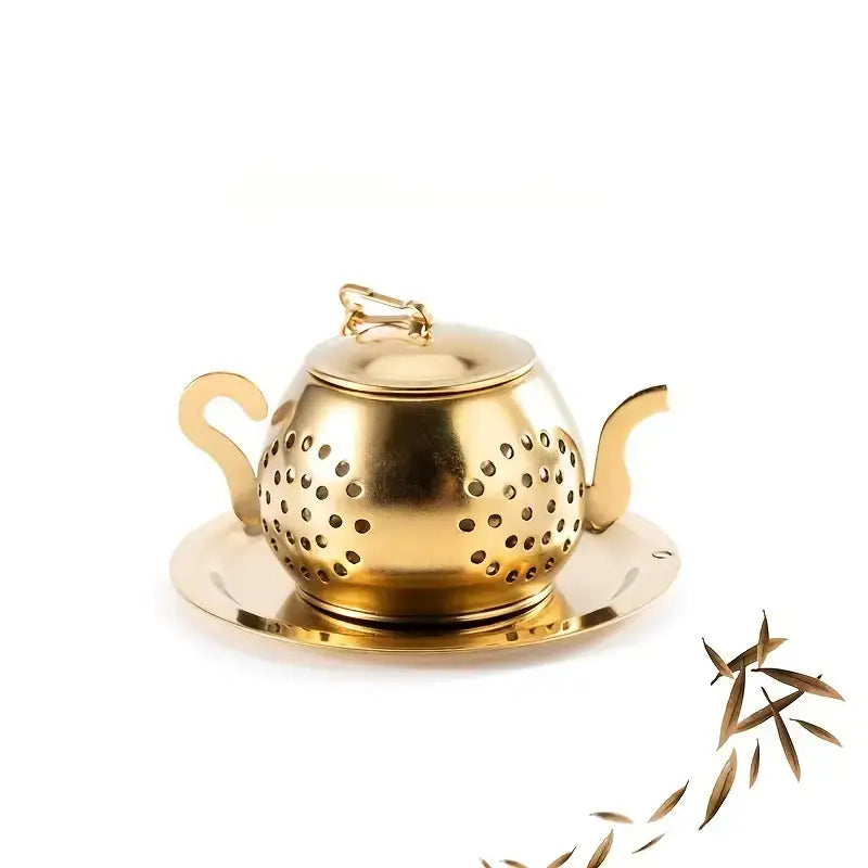 Gold tea strainer with perforated design on a white background