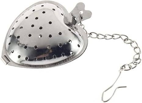 Heart-shaped metal tea infuser with a chain on a white background